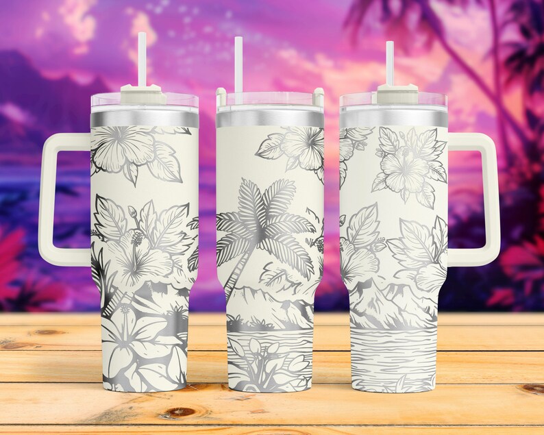 May include: Three stainless steel tumblers with a white background and silver hibiscus flower and palm tree design. The tumblers have a handle and a lid with a straw.