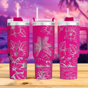 May include: Three pink stainless steel tumblers with a tropical floral design. Each tumbler has a lid, a handle, and a straw. The tumblers are on a wooden surface.