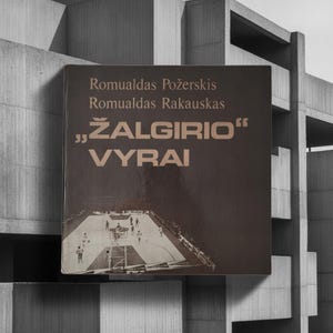 May include: A square book cover with a dark brown background featuring the text Romualdas Požerskis, Romualdas Rakauskas, and ŽALGIRIO VYRAI in a light tan font. The lower portion displays a black and white photograph of a basketball court.