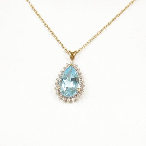 9ct Gold London Blue Topaz & Diamond Pendant and Gold Chain.
