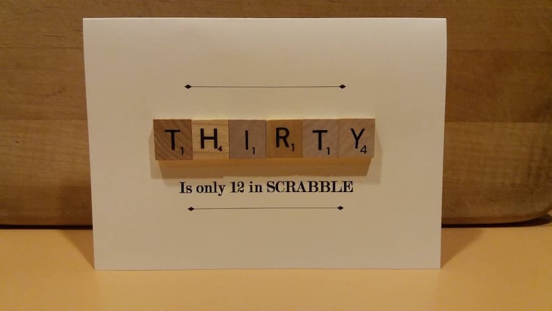 Puede incluir: Una tarjeta blanca con la palabra "THIRTY" deletreada con fichas de Scrabble. El texto debajo de las fichas dice "Is only 12 in SCRABBLE".
