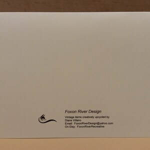 May include: White card with black text that reads "Foxon River Design" and includes contact information for the business. The text reads "Vintage items creatively upcycled by Diane Villano. Email: FoxonRiverDesign@yahoo.com. On Etsy: FoxonRiverRecreative."