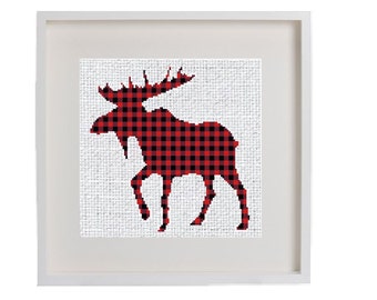 May include: A framed print of a red and black buffalo plaid moose silhouette on a white background.