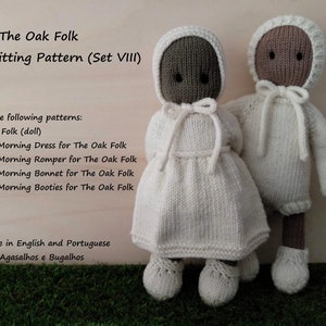 May include: Two knitted dolls wearing white outfits. The doll on the left is wearing a dress and the doll on the right is wearing a romper. Both dolls have brown skin and are wearing white knitted hats. The text "The Oak Folk Pdf Knitting Pattern (Set VIII)" is at the top of the image. The text "Includes the following patterns: - The Oak Folk (doll) Sunday Morning Dress for The Oak Folk Sunday Morning Romper for The Oak Folk Sunday Morning Bonnet for The Oak Folk Sunday Morning Booties for The Oak Folk Available in English and Portuguese Agasalhos e Bugalhos" is below the dolls.