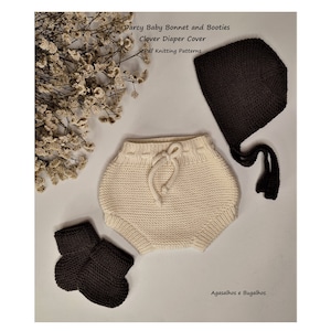 May include: Knitted baby bonnet, booties, and diaper cover in brown and cream colors. The pattern is called "Clover Diaper Cover" and is available as a PDF knitting pattern. The text "Darcy Baby Bonnet and Booties" and "Agasalhos e Bugalhos" is also visible in the image.