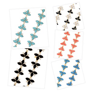 May include: Five different styles of flower-shaped chain trim with gold-colored metal and various colored stones. The chains are arranged in rows, with each row featuring a different color of stone: turquoise, black, coral, light blue, and white.