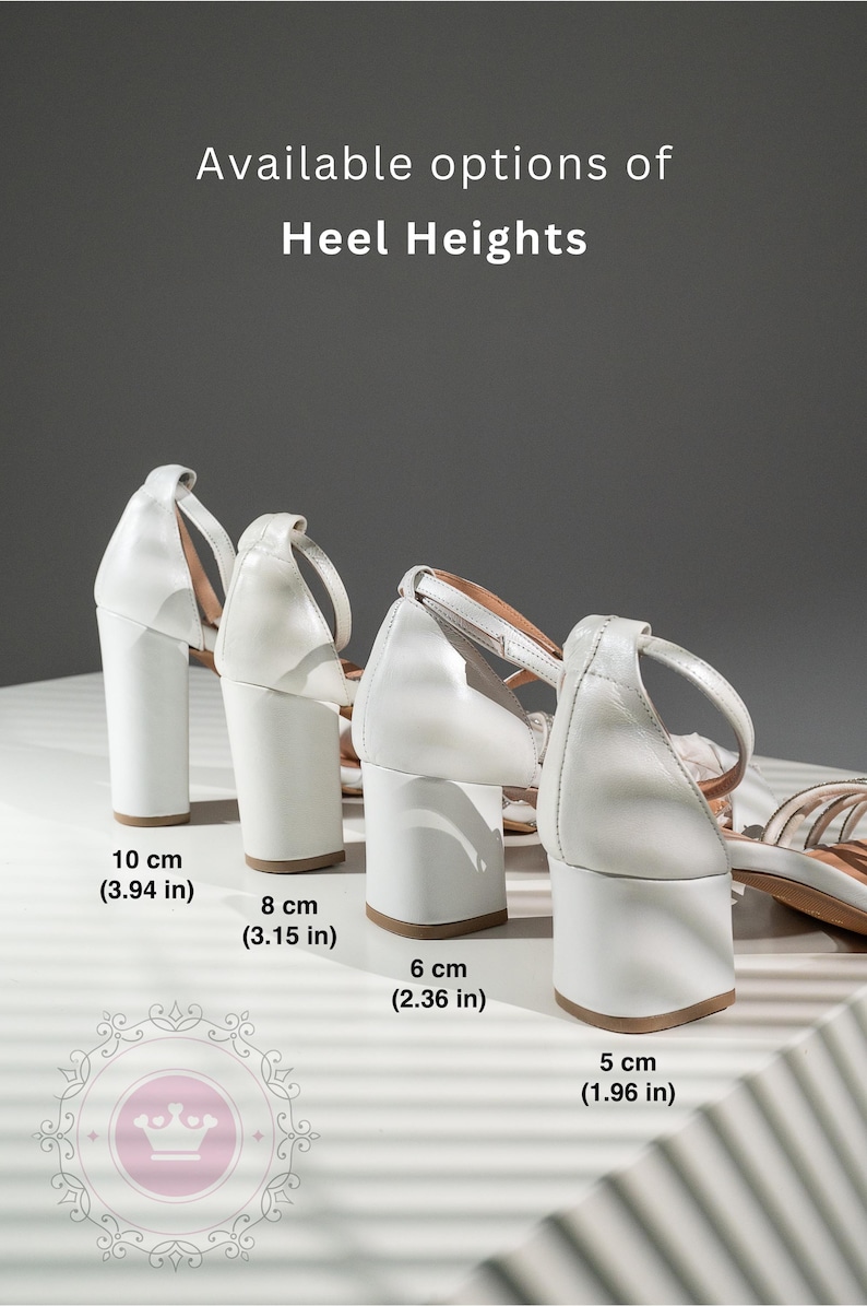 May include: Four pairs of white heeled sandals with different heel heights. The heels are 10 cm (3.94 in), 8 cm (3.15 in), 6 cm (2.36 in), and 5 cm (1.96 in).
