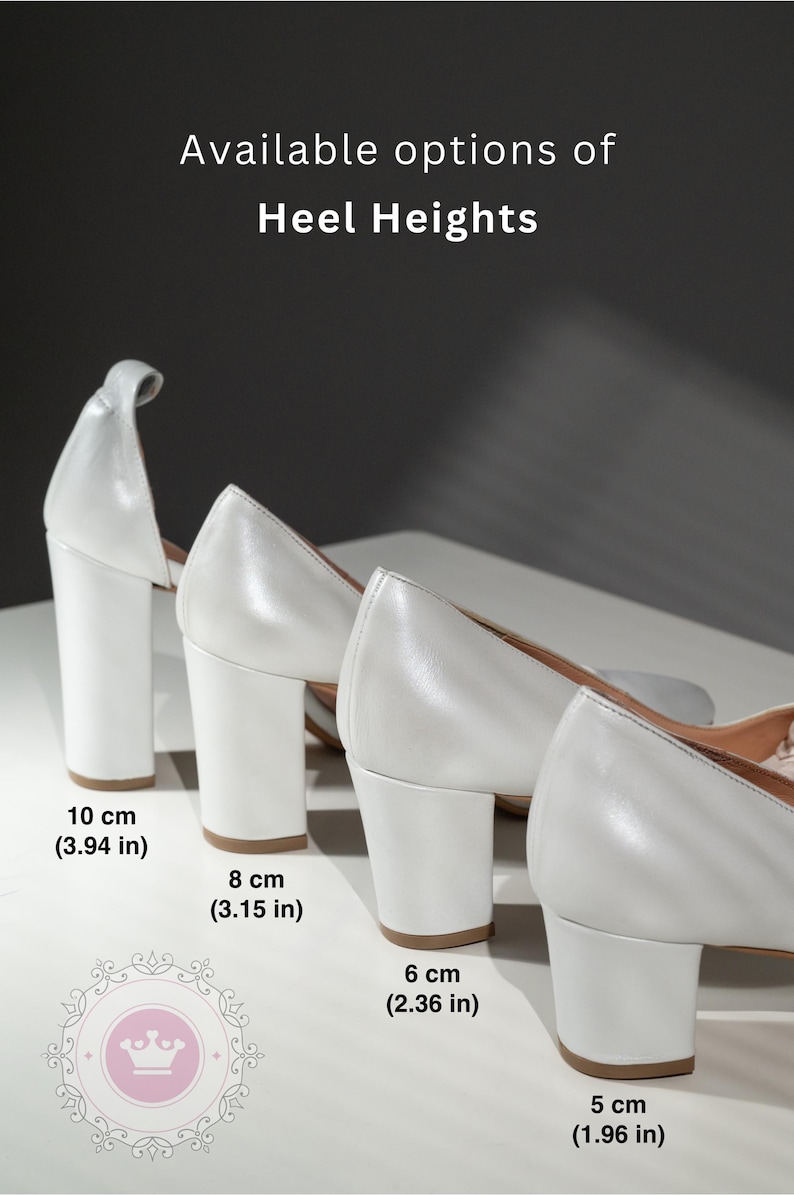 May include: Four pairs of white heeled shoes with different heel heights. The heels are 10 cm (3.94 in), 8 cm (3.15 in), 6 cm (2.36 in), and 5 cm (1.96 in).