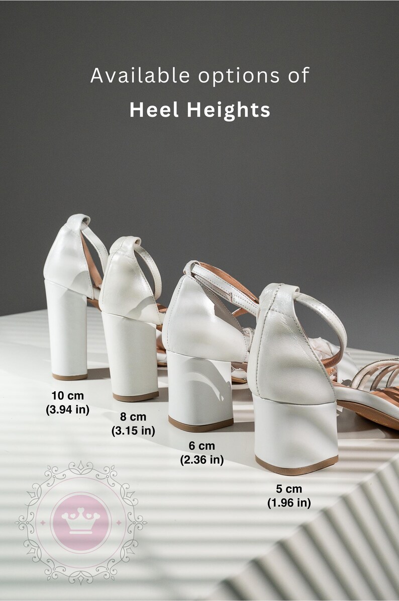 May include: Four pairs of white heeled sandals with different heel heights. The heels are 10 cm (3.94 in), 8 cm (3.15 in), 6 cm (2.36 in), and 5 cm (1.96 in).