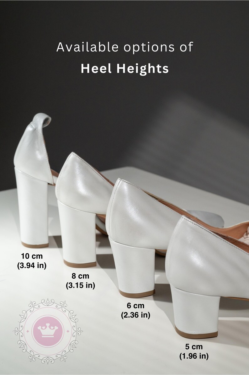 May include: Four pairs of white heeled shoes with different heel heights. The heels are 10 cm (3.94 in), 8 cm (3.15 in), 6 cm (2.36 in), and 5 cm (1.96 in).