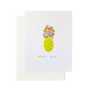 May include: A white card with a yellow pineapple with green leaves and a bouquet of pink, orange, and red flowers inside. The text "thank you!" is written in green below the pineapple.