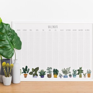 May include: A white framed calendar with the word "Kalender" at the top. The calendar is divided into 12 months with lines for each day. The bottom of the calendar features a row of illustrated potted plants in various colors and styles.