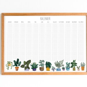 May include: A framed calendar with a white background and black text. The calendar is divided into 12 months, with each month having a row of lines for writing in dates and events. The bottom of the calendar features a row of potted plants in various colors and styles.