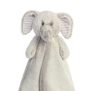 May include: A gray plush elephant baby blanket with a striped purple and white underside. The elephant has a gray and white striped ear.