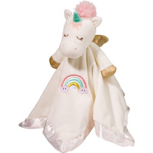 May include: A white plush unicorn toy with a pink pom-pom mane, gold accents, and a rainbow embroidered on a cream-colored blanket. The blanket has a satin trim with a pink dotted pattern.