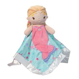 May include: A plush mermaid doll with blonde hair and a pink tail, wearing a pink seashell top, resting on a light blue blanket with a star and wave pattern. The blanket has a satin border.
