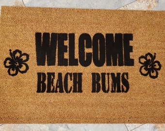 Welcome Beach Bums Doormat. Makes it feel like Summer is Here. Enjoy the sandy beach and Hawaiian flowers. The perfect gift for beach lovers