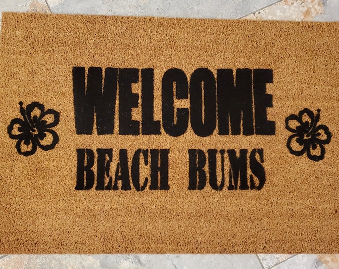 Welcome Beach Bums Doormat. Makes it feel like Summer is Here. Enjoy the sandy beach and Hawaiian flowers. The perfect gift for beach lovers