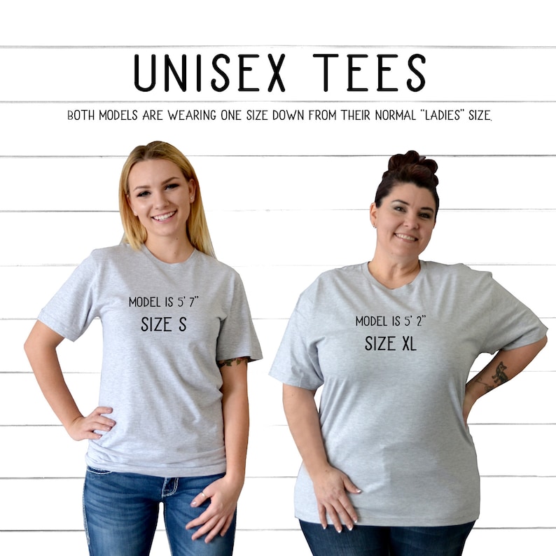May include: Two models wearing grey unisex t-shirts. The model on the left is 5'7" and wearing a size S. The model on the right is 5'2" and wearing a size XL. Both models are wearing one size down from their normal "ladies" size.