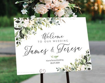 May include: A white wedding welcome sign with green and white floral watercolor designs. The sign reads "Welcome to our wedding James & Teresa #JameTeresaWedding 03.27.202X"