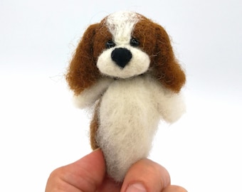 Dog finger puppet.