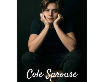 May include: A black and white wall calendar featuring a photo of Cole Sprouse. The calendar has the text "Cole Sprouse Wall Calendar" printed on the bottom.