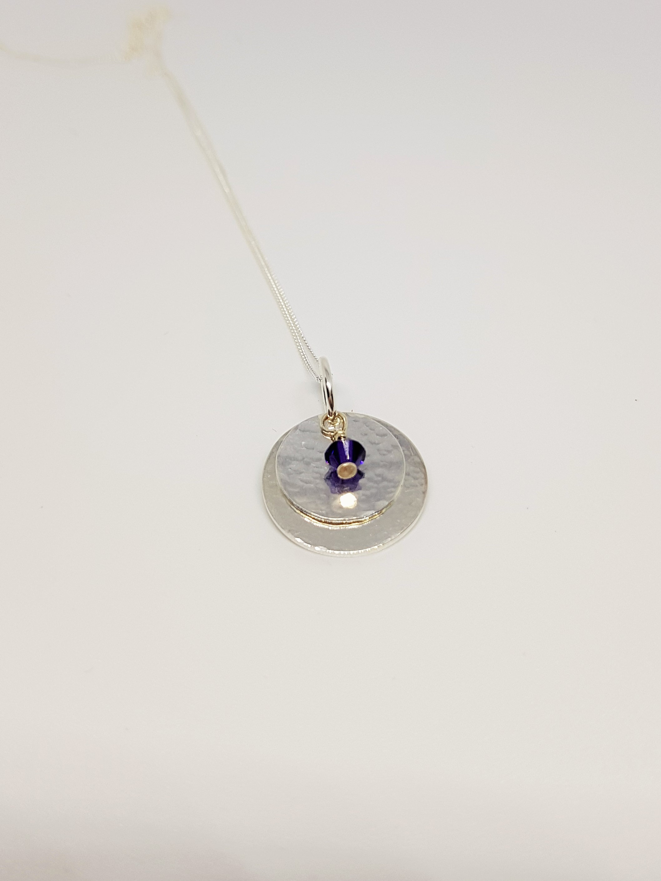 Double Layer Disc Sterling Silver Pendant With Purple Crystal on