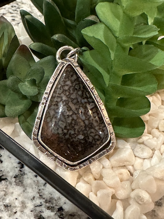 Dinosaur bone pendant