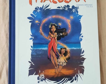 May include: A book cover with a blue spine and a white background. The title "THALULAA" is in orange and red letters. The cover features an illustration of two women with dark hair and brown skin standing on a beach at night. The woman in the front is holding a glowing orange circle in her hands. The text "EDITION SPECIALE T.1 T.2" is in black letters at the top of the cover.