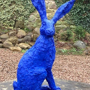 A blue hare, the colour of the sea, Ultramarine.  An unusual and outlandish colour for this upright oversized hare with large listening ears