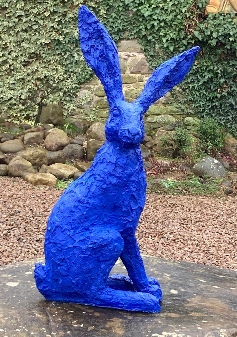 A blue hare, the colour of the sea, Ultramarine.  An unusual and outlandish colour for this upright oversized hare with large listening ears