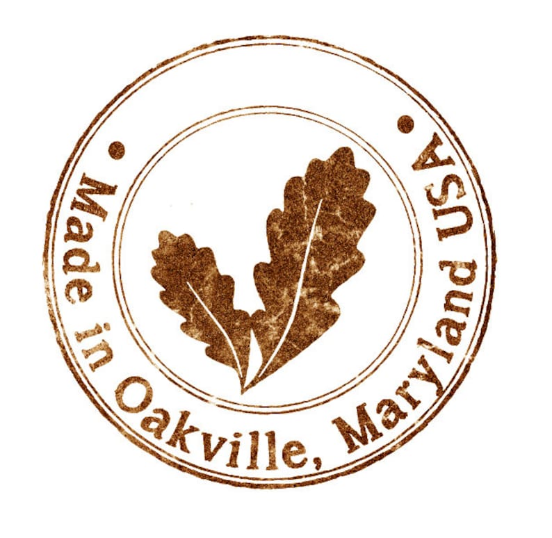 May include: A brown, circular stamp with the text "Made in Oakville, Maryland USA" and a stylized oak leaf design.