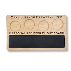 May include: A wooden beer flight board with four individual cup holders and a chalkboard area. The board is engraved with the text "Oakvilleshop Brewery & Pub" and "Personalized Beer Flight Board".