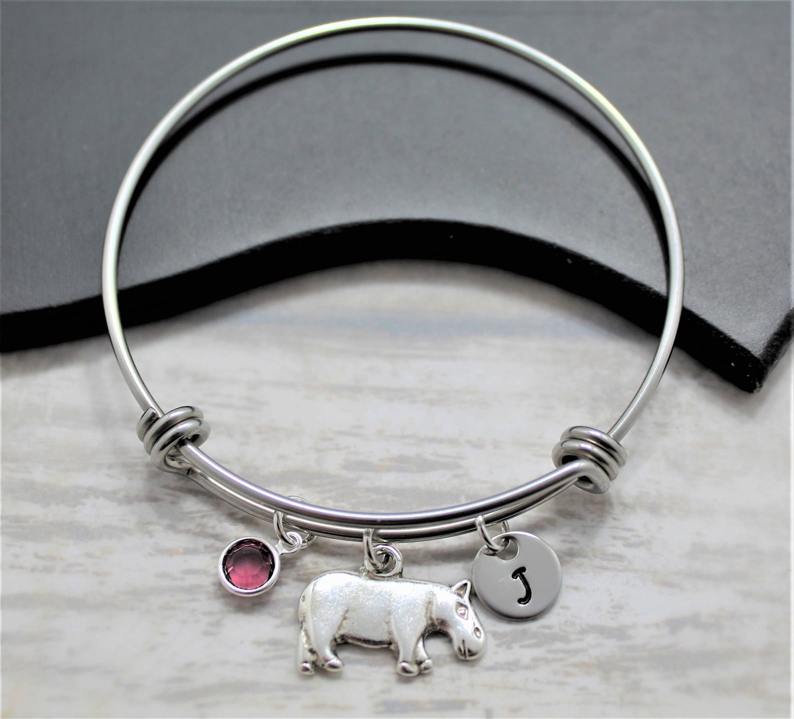 bracelet with a locket shaped like a hippo