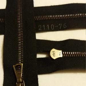 RIRI  Antique Brass open end jacket zipper 76 cm long.  Black  M 4