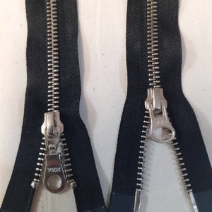 Zips. 2 way sliders. Silver teeth.