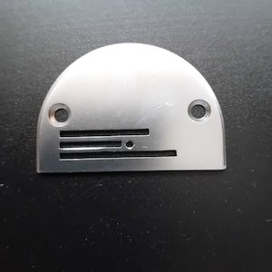 Needle plate for industrial sewing machine