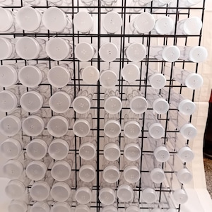 Button tubes with storage rack