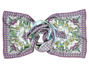 May include: A white silk scarf with a colorful print of people and animals. The scarf has a pink border with a repeating pattern of flowers and geometric shapes. The text "The Day Trippers" is printed on the scarf.