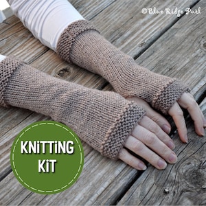 May include: A knitting kit for making brown fingerless gloves. The kit includes yarn and instructions. The gloves are shown on a wooden surface.