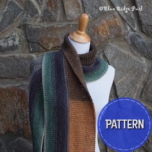 May include: A knitted scarf displayed on a mannequin. The scarf features a color gradient from dark blue to green to brown. The text "Blue Ridge Purl" is in the upper right corner. A blue circle with the word "PATTERN" is in the lower right corner.