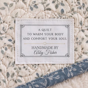 May include: A white ceramic mug with a black handle and the text "But First, Coffee" in a black, bold font. The mug is sitting on a white surface. The mug is approximately 4 inches tall.