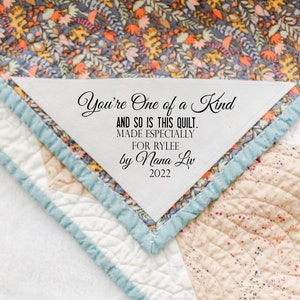 Corner Quilt Labels personalized for you on cotton fabric in sew on and measuring approximately 6 x 6"