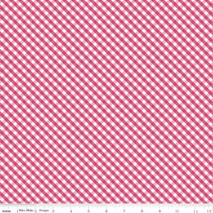 May include: A fabric with a diagonal gingham pattern in white and a vibrant shade of pink. The fabric is marked with inches along the bottom edge. The text "Riley Blake Designs" is visible.