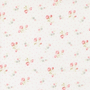 May include: White fabric with a repeating pattern of pink roses and small blue flowers. The design also includes small pink polka dots scattered across the surface, creating a delicate and feminine aesthetic. Ideal for crafting and sewing projects.