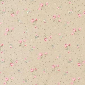 May include: A beige fabric with a repeating pattern of pink roses and small blue flowers. The floral design is interspersed with tiny gray polka dots, creating a delicate and vintage aesthetic. The fabric has a subtle texture.
