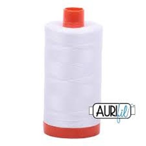 May include: A white spool of thread with an orange plastic bobbin. The spool is labeled "AURIfil" in blue lettering.