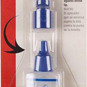 May include: A blue bottle of Fray Check fabric glue with a screw-on applicator. The bottle is labeled "Fray Check" and "Fray Check with Fabric Guide Applicator". The bottle is 3/4 fl oz (22.5 ml).