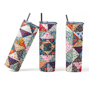 May include: Three stainless steel tumblers with a patchwork quilt design. The tumblers are all the same size and shape, but each has a different color scheme. The tumblers are all standing upright on a white background.