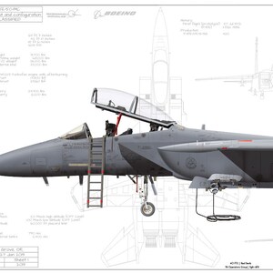 May include: A gray F-15E Strike Eagle fighter jet with a refueling boom attached. The jet has a gray and black camouflage paint scheme with red and white markings on the tail. The tail has the text "ET 40 FTS AF 252".
